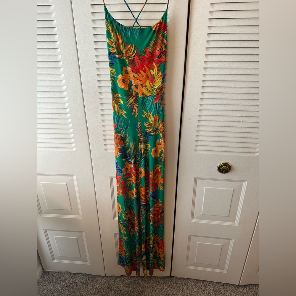 this is a stretch material jumpsuit it was worn once.   Medium